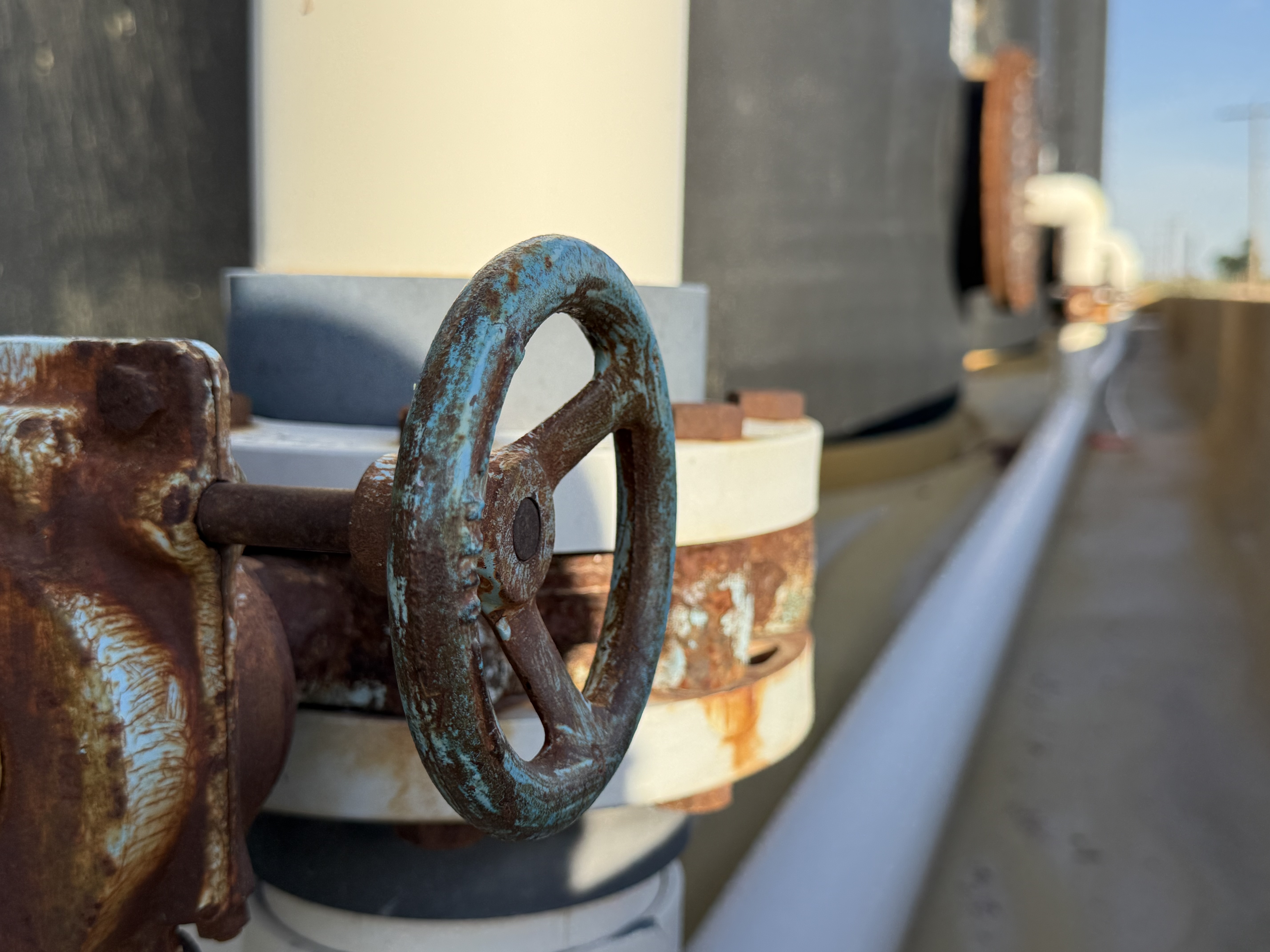Close-up of a brine tank valve and piping at the facility